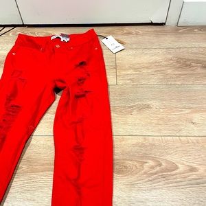 Brand new red ripped skinny jeans